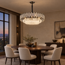 OMBRIA Medium black crystal chandelier over oval walnut dining table