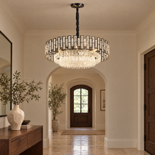 OMBRIA Medium black crystal chandelier in a limestone foyer