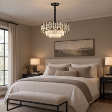 OMBRIA Small black crystal chandelier above a neutral bedroom