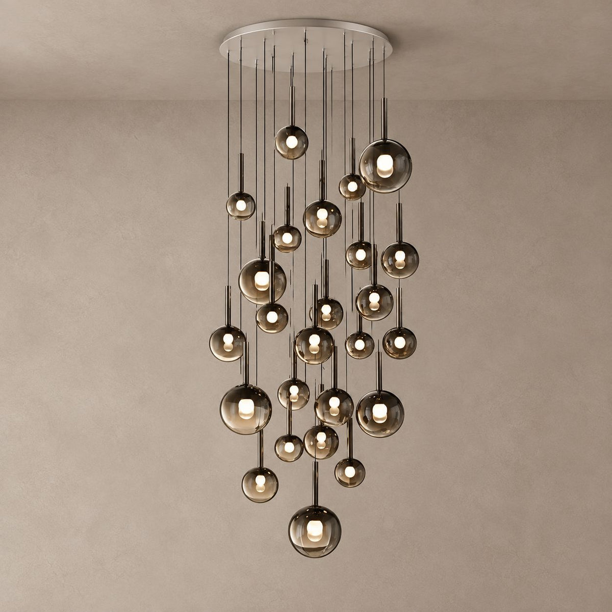 OPHIRA chandelier with 25 smoky glass globes cascading from a round ceiling canopy on mushroom taupe