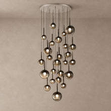 OPHIRA chandelier with 25 smoky glass globes cascading from a round ceiling canopy on mushroom taupe