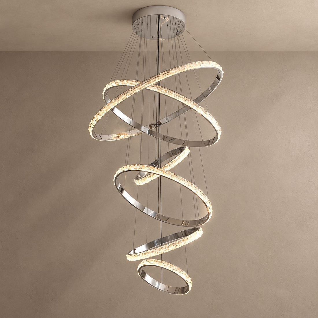 OPUS six-ring crystal and silver chandelier on mushroom taupe plaster with natural shadows