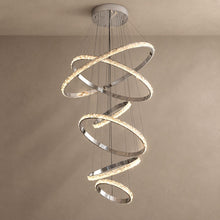 OPUS six-ring crystal and silver chandelier on mushroom taupe plaster with natural shadows