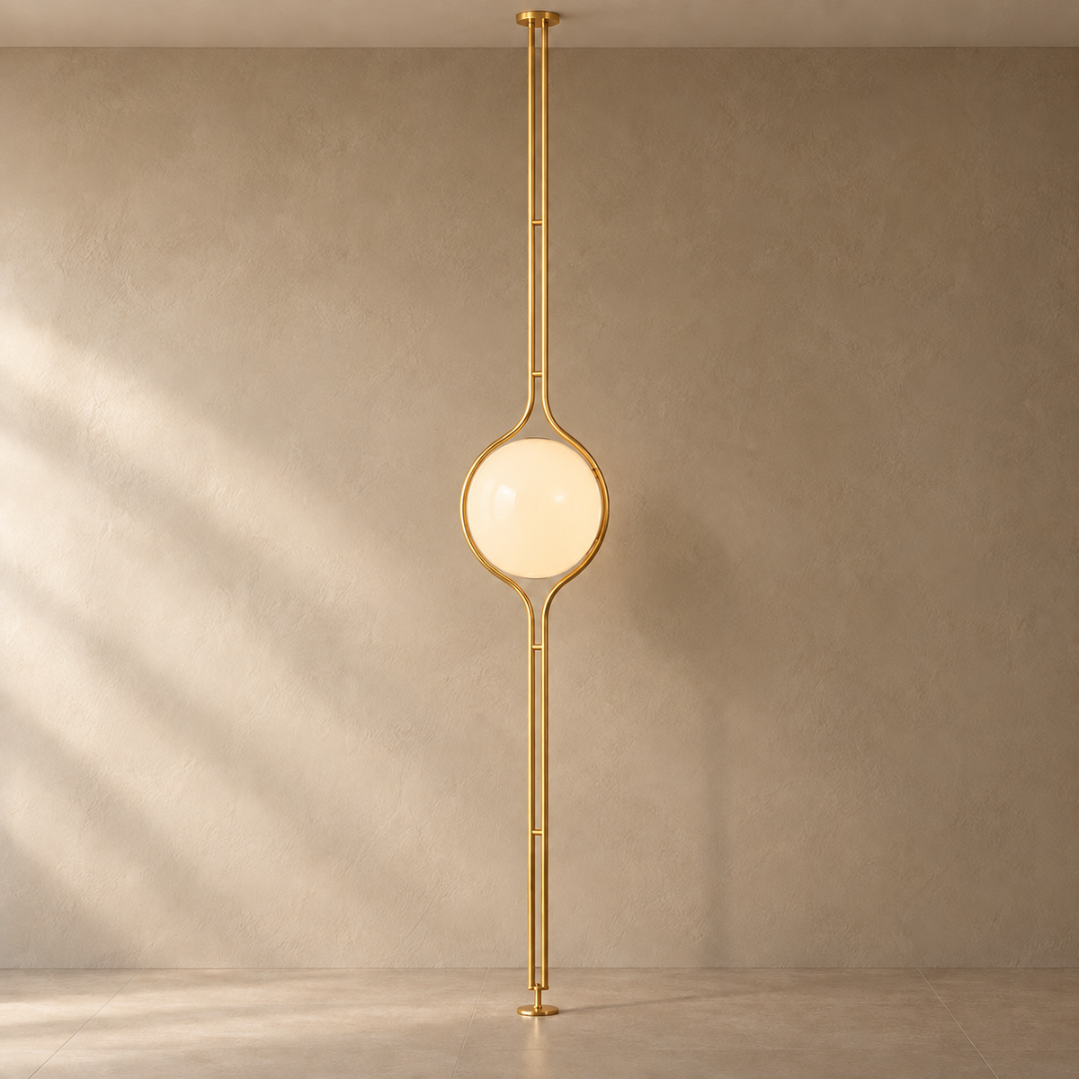 ORELIA Brass floor-to-ceiling globe lamp on a mushroom taupe background