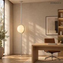 ORELIA Silver lamp next to an oak desk in a naturally lit home office