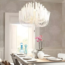 CERYNE - White wood chandelier over a traditional dining table