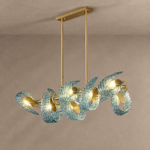 PAVO dining chandelier with teal textured glass leaves and brass linear frame on mushroom taupe plaster