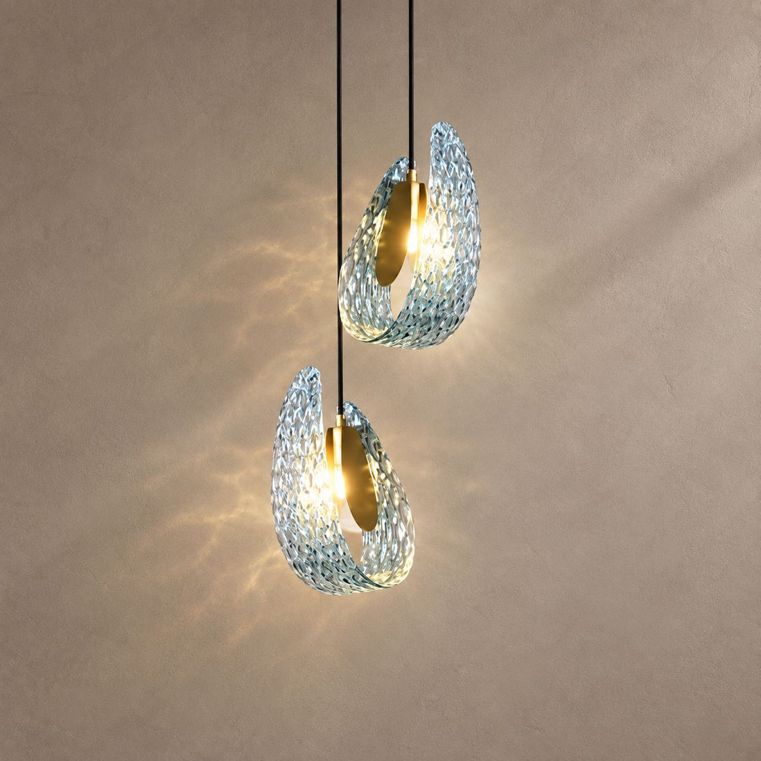 PAVO (PENDANT) lighting on a mushroom taupe background with natural shadows