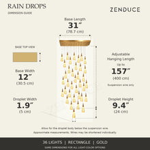 RAIN DROPS 36-light rectangle gold AVELLE dimension guide: base 31 inches long by 12 inches wide; suspension wire up to 157 inches, plus a 9.4-inch high by 1.9-inch wide droplet. Inch values are prominent with centimetres below.