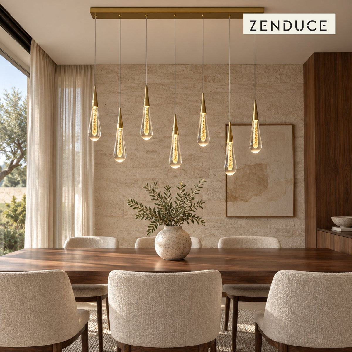 RAIN DROPS 7-light rectangular gold and crystal chandelier installed over a walnut dining table in a limestone and cream dining room.