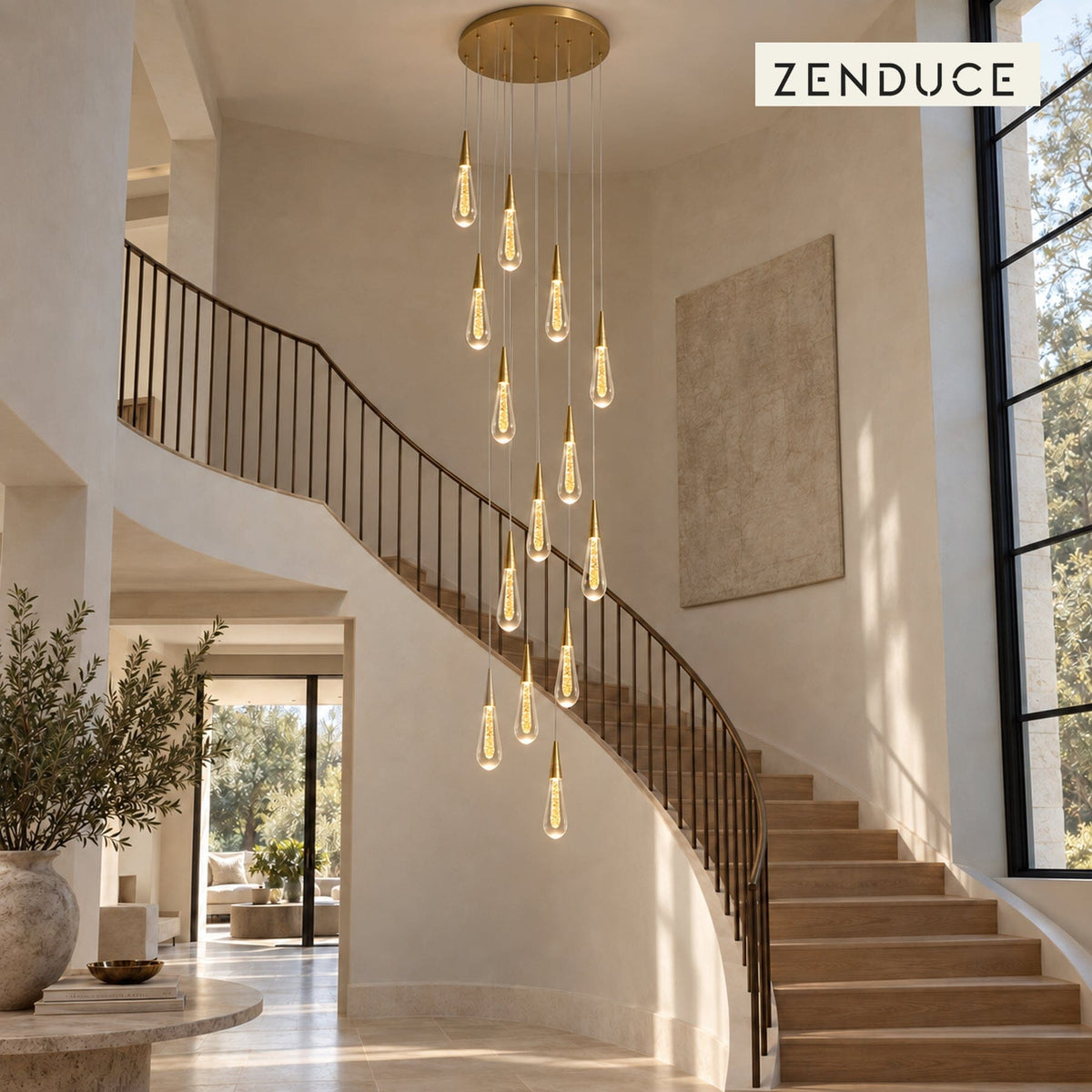 RAIN DROPS 14-light round gold and crystal chandelier cascading beside visible oak stair treads in a double-height limestone foyer.