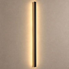 RAYN slim black wall light mounted on mushroom taupe plaster with warm backlight and natural shadows