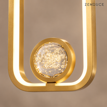 SELYA Gold frame close-up showing the bubble crystal sphere and illuminated inner edge