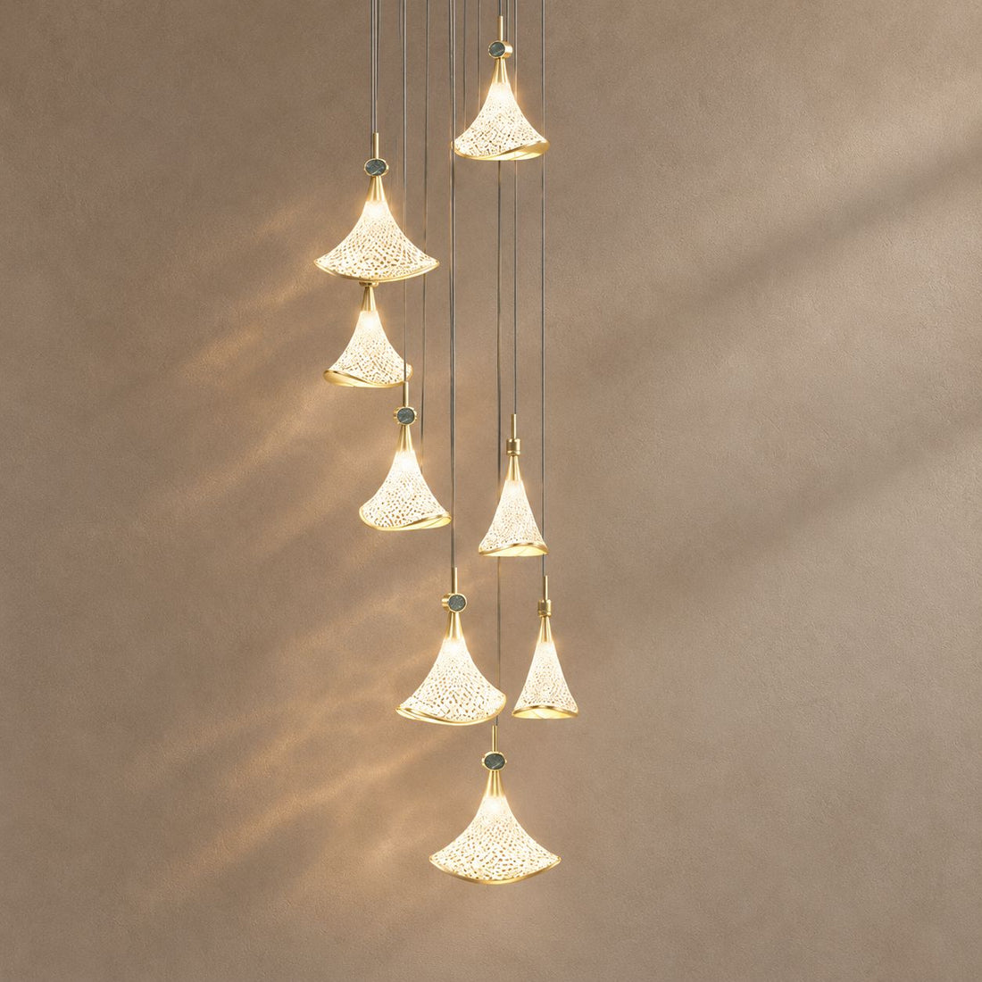 SHELL lighting on a mushroom taupe background with natural shadows