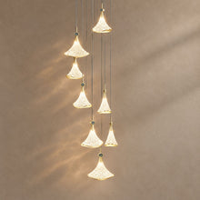 SHELL lighting on a mushroom taupe background with natural shadows