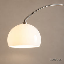 Close-up of SILENNA white glass shade and polished metal arc connection