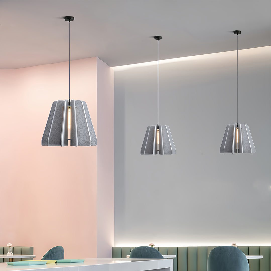 FELLA - Gray felt pendants arranged over a kitchen island