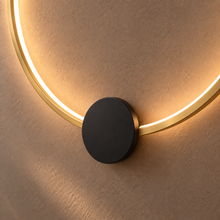 Close up of SOLIA gold LED ring and black mounting disc