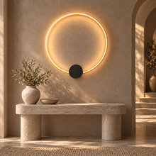 SOLIA gold large wall light over stone console in foyer