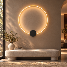 SOLIA gold large circular LED wall light above cream bench