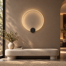 SOLIA gold medium circular LED wall light with black mounting disc