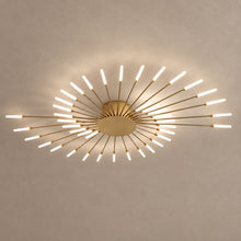 SPARKLER gold sunburst ceiling light with slim illuminated rods on mushroom taupe plaster