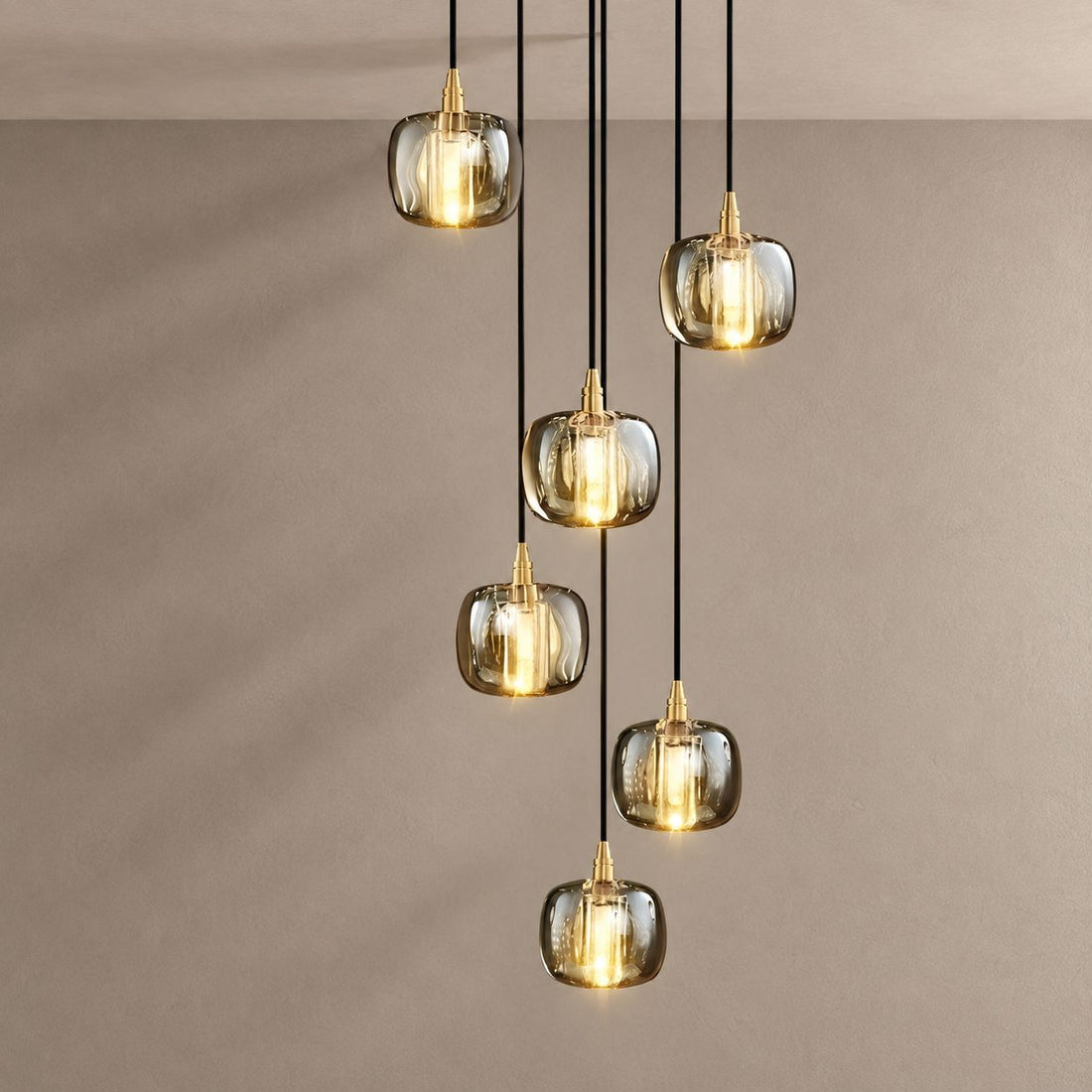 SPHERO chandelier on mushroom taupe with soft natural shadows
