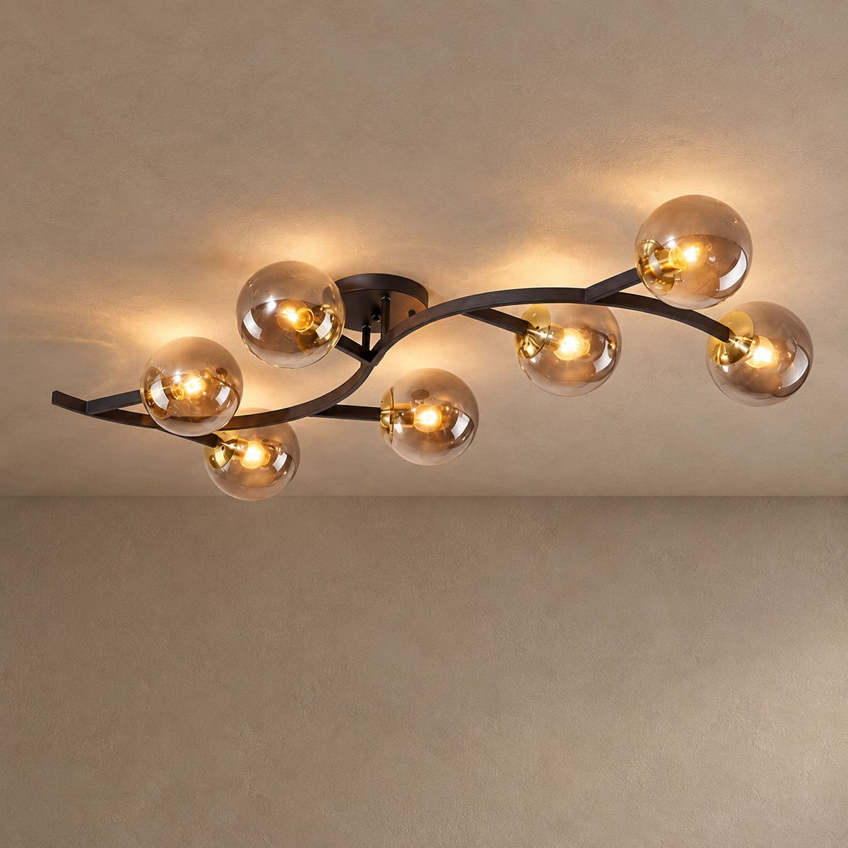 SPRIG lighting on mushroom taupe plaster with natural shadows