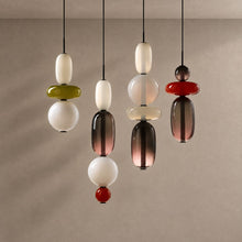 TOTEM lighting with natural shadows against a mushroom taupe background