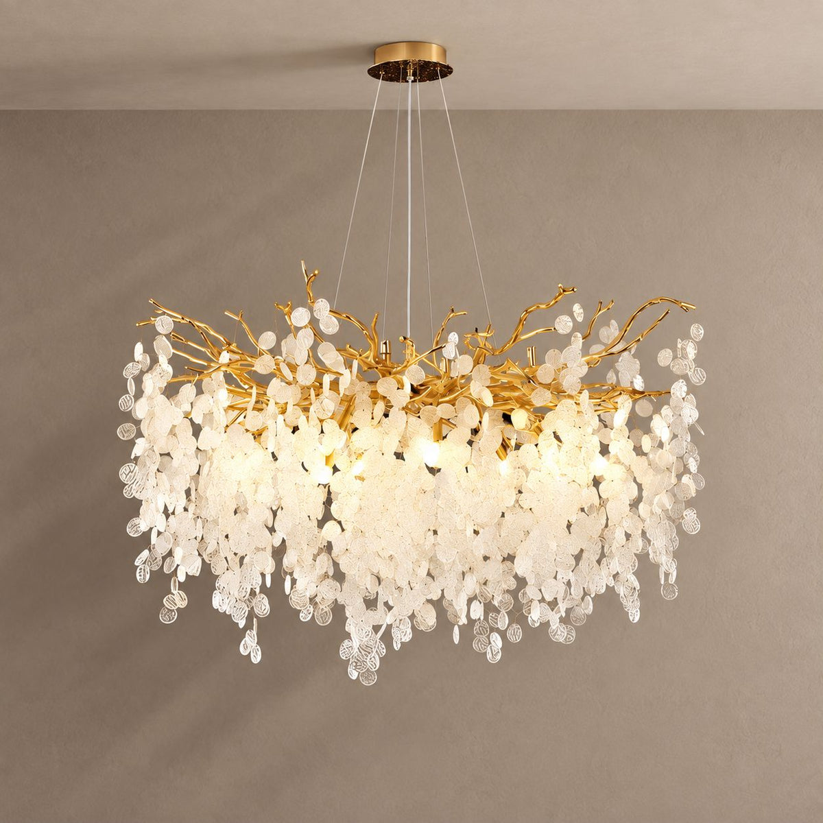 VALORA chandelier on mushroom taupe with soft natural shadows
