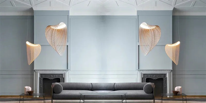 LUCORA four wood-strip pendants flanking two fireplaces in a living room