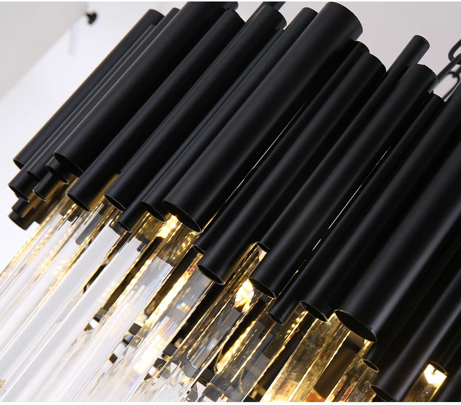 MYSTIQUE close-up of black tubes and lit clear crystal rods from below