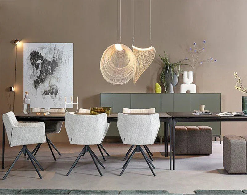 LUCORA two wood-strip pendants above a long dining table with white chairs