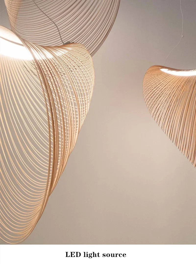 LUCORA lit pendants showing the LED strip inside the wood-strip shade