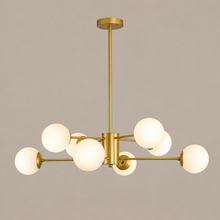 35 in Gold 8-Light Glass Globe Chandelier on a mushroom taupe background