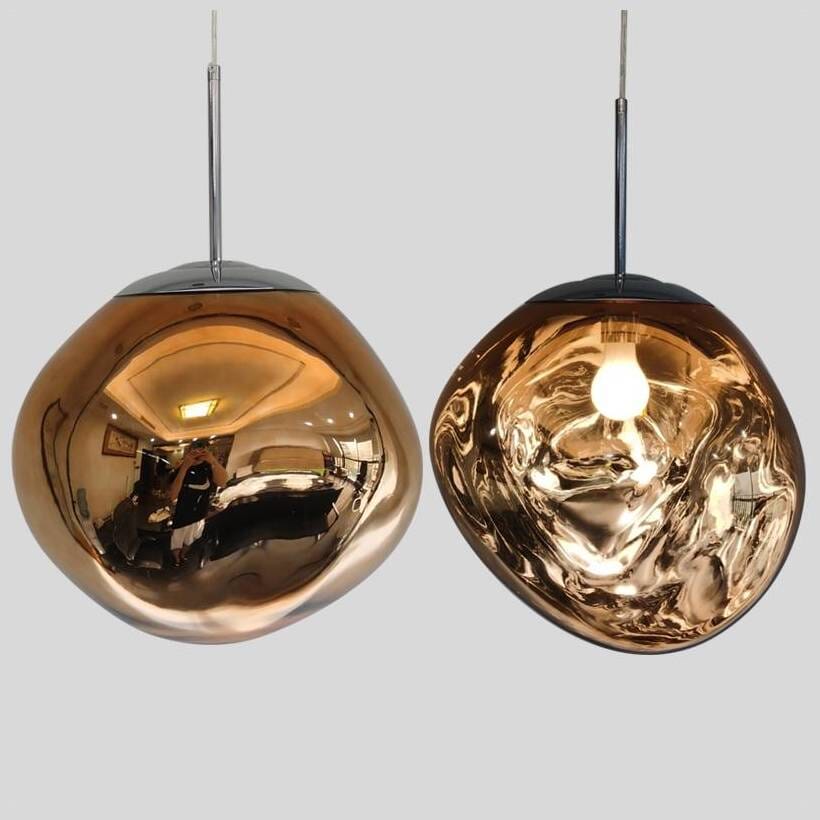 LAVA amber pendant pair, one unlit with mirror finish and one lit showing the bulb